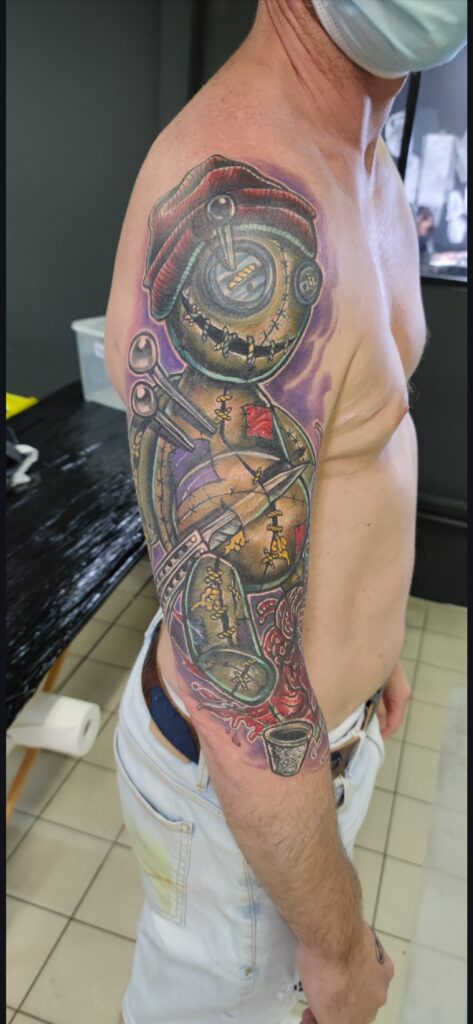 Cover up a dark tribal with cartoon vaudoo